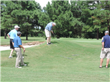 Bill Crow attempts to golf